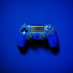 Blue Playstation controller with blue background